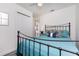 Inviting bedroom featuring a stylish metal bed frame, ceiling fan and closet space at 5041 N Beach Rd # 1A And 1B, Englewood, FL 34223