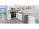 Well-equipped kitchen with stainless steel appliances, granite counters, and modern cabinets at 5041 N Beach Rd # 1A And 1B, Englewood, FL 34223