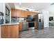 This well-lit kitchen features stainless steel appliances and direct access to other living spaces, creating a modern and efficient cooking area at 5041 N Beach Rd # 1A And 1B, Englewood, FL 34223