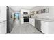 Well-equipped kitchen with stainless steel appliances, granite counters, and an open floorplan at 5041 N Beach Rd # 1A And 1B, Englewood, FL 34223