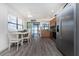 Bright kitchen and dining area featuring stainless steel appliances and a seamless transition to a covered outdoor space with water views at 5041 N Beach Rd # 1A And 1B, Englewood, FL 34223