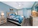 Cozy main bedroom featuring coastal themed décor, a ceiling fan, and ample closet space, offering a comfortable and relaxing retreat at 5041 N Beach Rd # 1A And 1B, Englewood, FL 34223