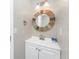 Bathroom featuring a rustic mirror, modern vanity, and essential amenities at 5041 N Beach Rd # 3A And 3B, Englewood, FL 34223