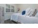 Small bedroom with natural light, nautical decor, and comfortable furnishings at 5041 N Beach Rd # 3A And 3B, Englewood, FL 34223