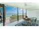 Spacious covered patio offers stunning waterfront views and outdoor seating for relaxation at 5041 N Beach Rd # 3A And 3B, Englewood, FL 34223