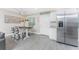 Cozy dining area with bar seating and a view of the kitchen at 5041 N Beach Rd # 3A And 3B, Englewood, FL 34223