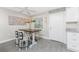 Charming dining area with rustic table and contemporary chairs at 5041 N Beach Rd # 3A And 3B, Englewood, FL 34223