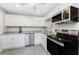 Well-lit kitchen featuring stainless steel appliances and sleek cabinets at 5041 N Beach Rd # 3A And 3B, Englewood, FL 34223