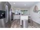 Modern kitchen featuring stainless steel appliances, island with barstool seating and plenty of natural light at 5041 N Beach Rd # 3A And 3B, Englewood, FL 34223
