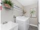 Functional laundry room equipped with a washer, dryer, and ample storage space at 5041 N Beach Rd # 3A And 3B, Englewood, FL 34223