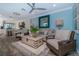 Well-lit living room features coastal decor, an area rug, and an open layout at 5041 N Beach Rd # 3A And 3B, Englewood, FL 34223