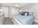 Inviting main bedroom with a comfortable bed, soft lighting, and ample closet space at 5041 N Beach Rd # 3A And 3B, Englewood, FL 34223