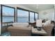 Well appointed sunroom with water views, ceiling fan, and comfortable rattan furniture at 5041 N Beach Rd # 3A And 3B, Englewood, FL 34223