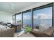 Bright sunroom with floor to ceiling windows providing amazing views of the water at 5041 N Beach Rd # 3A And 3B, Englewood, FL 34223