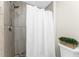 Bathroom shower featuring a modern shower head and stone tile design at 5041 N Beach Rd # 4A And 4B, Englewood, FL 34223