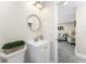 Bathroom with white vanity and a view into the living room at 5041 N Beach Rd # 4A And 4B, Englewood, FL 34223