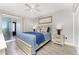 Cozy bedroom featuring a queen bed, neutral walls, and access to a balcony at 5041 N Beach Rd # 4A And 4B, Englewood, FL 34223