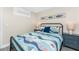 Comfortable bedroom features a ceiling fan and stylish nautical decor at 5041 N Beach Rd # 4A And 4B, Englewood, FL 34223