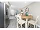 Open-concept kitchen and living area with stainless steel appliances and wood-look tile flooring at 5041 N Beach Rd # 4A And 4B, Englewood, FL 34223