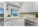 Bright kitchen features stainless steel appliances and views of the water from the balcony at 5041 N Beach Rd # 4A And 4B, Englewood, FL 34223