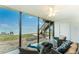 Inviting covered patio with waterfront views and comfortable seating, perfect for relaxation at 5041 N Beach Rd # 4A And 4B, Englewood, FL 34223