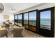 Bright sunroom with lots of natural light and water views, perfect for relaxation at 5041 N Beach Rd # 4A And 4B, Englewood, FL 34223