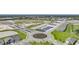 Planned community with a roundabout, ponds, tennis courts, and newly built homes in a suburban setting at 5132 Schubert Trl, North Port, FL 34287