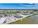 Primary-planned community featuring a pool under construction, new homes, ponds and green spaces at 5132 Schubert Trl, North Port, FL 34287