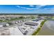 Community with a pool under construction, new homes, ponds, green spaces, and tennis court at 5132 Schubert Trl, North Port, FL 34287