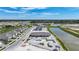 New pool and clubhouse construction with tennis courts, surrounding ponds, and modern home community at 5132 Schubert Trl, North Port, FL 34287
