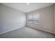 Well-lit bedroom with a window and neutral carpeting, creating a comfortable and inviting space at 5132 Schubert Trl, North Port, FL 34287