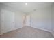 Cozy bedroom with two closets and neutral carpeting, creating a comfortable and inviting space at 5132 Schubert Trl, North Port, FL 34287