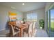 Inviting dining area featuring a table with seating for six, a buffet and view to the outdoors at 5132 Schubert Trl, North Port, FL 34287
