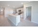 Modern kitchen featuring an island with a sink, white cabinets, and stainless steel appliances at 5132 Schubert Trl, North Port, FL 34287