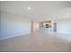 Spacious living room featuring tile floors, recessed lighting and a modern kitchen area at 5132 Schubert Trl, North Port, FL 34287