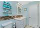 Bathroom with a stacked tower rack with rolled towels on shelves at 52 Golfview Ter, Rotonda West, FL 33947
