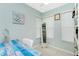 Bright bedroom featuring a cute desk and storage shelves, perfect for a room or home office at 52 Golfview Ter, Rotonda West, FL 33947