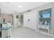 Inviting foyer featuring tile flooring, double doors, and coastal decor at 52 Golfview Ter, Rotonda West, FL 33947
