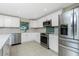 Well-equipped kitchen features stainless steel appliances, ample storage, and modern design elements at 52 Golfview Ter, Rotonda West, FL 33947