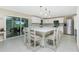 Bright kitchen with a large center island, stainless steel appliances, and ample seating at 52 Golfview Ter, Rotonda West, FL 33947