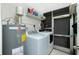 Laundry room features a washing machine, dryer, and a water heater at 52 Golfview Ter, Rotonda West, FL 33947