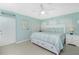 A spacious main bedroom features a large bed, ample storage, and cool, calming paint at 52 Golfview Ter, Rotonda West, FL 33947