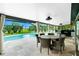 Outdoor dining area with a view of the pool and backyard at 52 Golfview Ter, Rotonda West, FL 33947