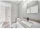 Updated bathroom with modern vanity and faucet, adjacent to a tiled walk-in shower at 5881 Talbrook Rd, North Port, FL 34287
