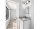 Well-lit bathroom featuring a modern vanity with gray countertop at 5881 Talbrook Rd, North Port, FL 34287