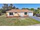Charming single Gathering home featuring a manicured lawn and attached one car garage at 5881 Talbrook Rd, North Port, FL 34287