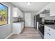 Modern kitchen with sleek stainless steel appliances, stylish countertops, and ample cabinet space at 5881 Talbrook Rd, North Port, FL 34287