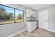 Modern kitchen with sleek white cabinets, stylish countertops, and stainless steel appliances at 5881 Talbrook Rd, North Port, FL 34287