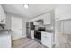 Updated kitchen features modern appliances, ample storage, and stone countertops at 5881 Talbrook Rd, North Port, FL 34287