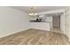 Dining area featuring hardwood style floors and view into the kitchen at 6610 Gasparilla Pines Blvd # 111, Englewood, FL 34224